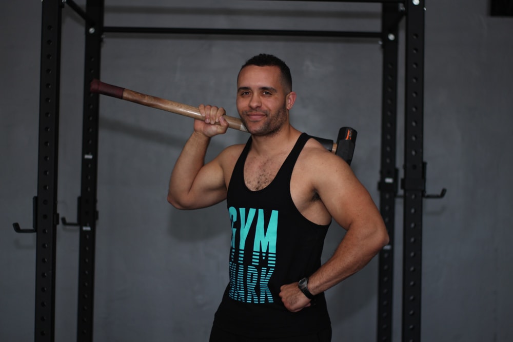 chase the personal trainer with hammer in gym