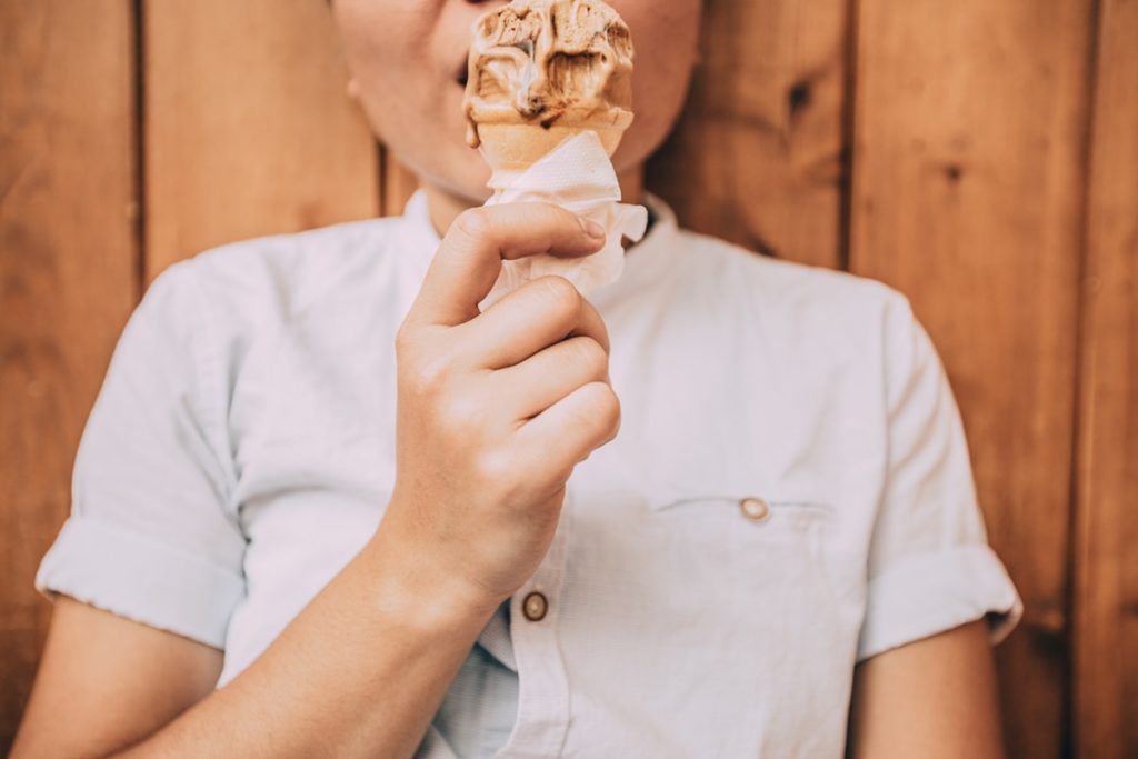 why is dieting so hard? woman eating ice cream